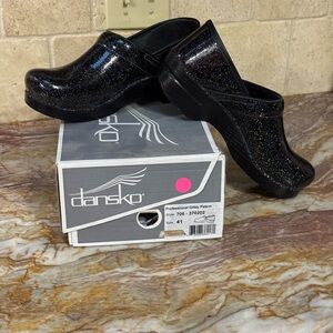 Dansko Black Glitter Patent Clogs